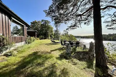 Image de Waterfront villa in Långstrandsudd: Panoramic views, private sauna, and dock