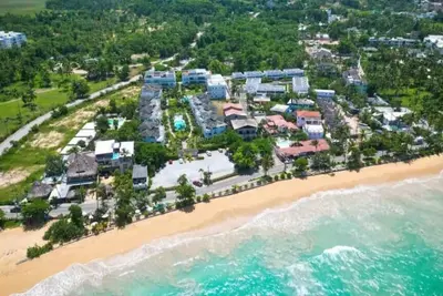 Image de 3br Renovated Beachfront Condo + Cooking/Cleaning