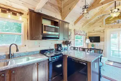Image de 2 tiny home cabins with private hot tubs, covered porches, & amazing views