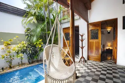 Colonial Elegance and Poolside Retreat