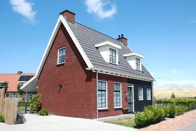 Image de Comfortable detached villa for 8 people with sauna and garden in a small-scale park on the Zeeland coast